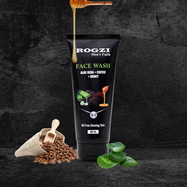 A face wash tube is prominently displayed against a textured black background, featuring the ingredients: aloe vera, coffee, and honey. Drizzling honey is shown above the tube, while coffee beans and leaves are placed beside it. The label highlights its 3-in-1 formula for oil-free glowing skin.