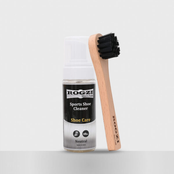 A foaming shoe cleaner with a brush is centered in the image, showcasing the cleaning product and tool together for easy use.