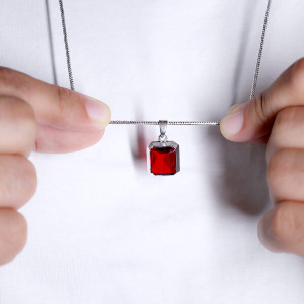 Wear this red stone pendant as a reminder to embrace love and vitality in your life.