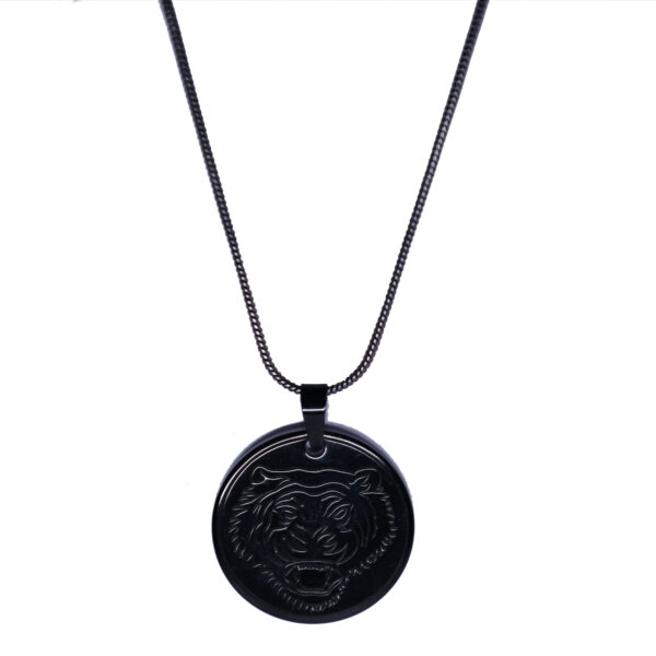 "Lion face pendant with a black chain, displayed against a white background. The pendant and chain are clearly visible, with the details of the lion face standing out against the plain white backdrop."