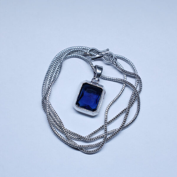 Let the deep hues of this blue stone pendant elevate your look, adding a touch of sophistication.